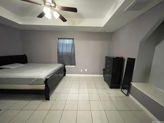 a bedroom with a bed and a walk in closet