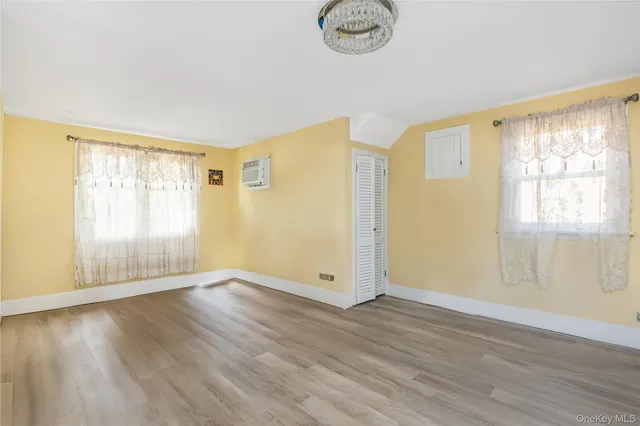 a bathroom with a tub shower and sink