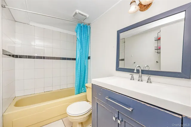 a bedroom with a bed and chair