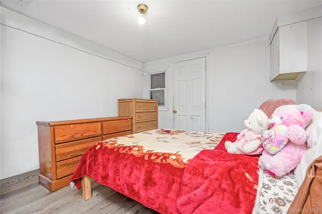 a view of entryway with wooden floor and a front door
