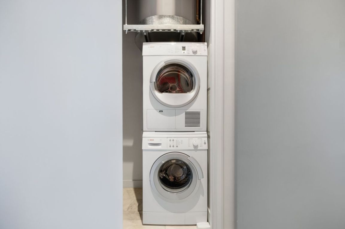 210 Lavaca Street, Unit 2809 Austin, TX 78701 - Photo 15 of 30 Laundry area with stacked washer / drying machine