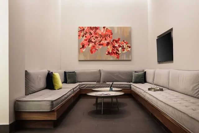 a view of a room with lots of wooden furniture