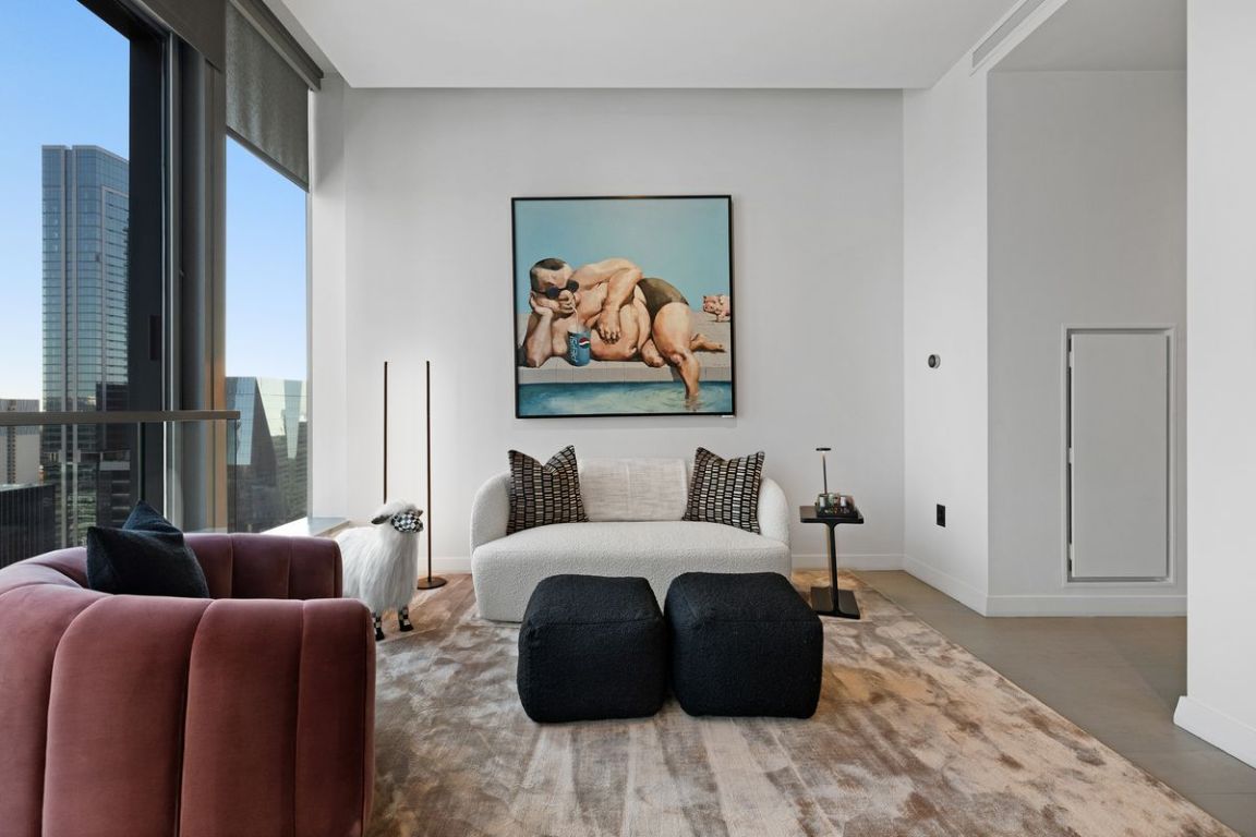 210 Lavaca Street, Unit 2809 Austin, TX 78701 - Photo 10 of 30 Living area featuring expansive windows and baseboards