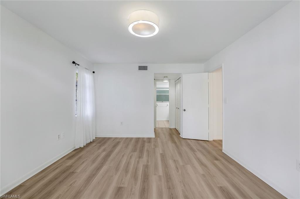 3200 Binnacle Drive, Unit B4 Naples, FL 34103 - Photo 8 of 25 a view of a room with wooden floor and white walls