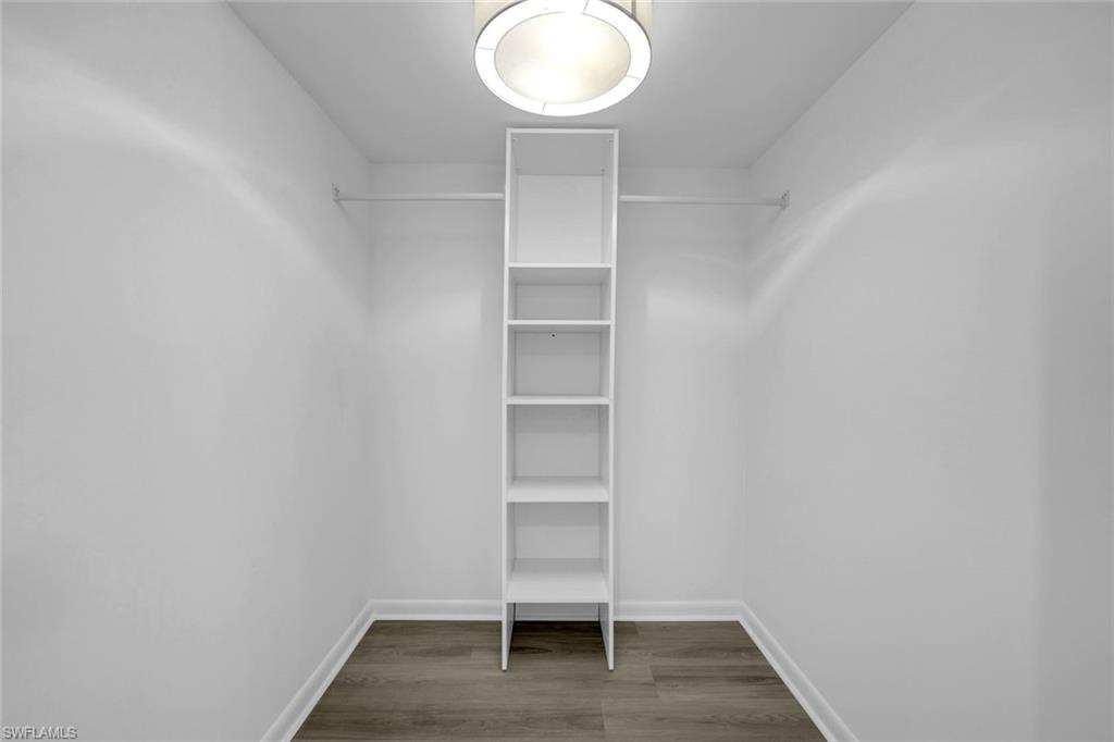3200 Binnacle Drive, Unit B4 Naples, FL 34103 - Photo 10 of 25 a view of walk in closet with empty racks