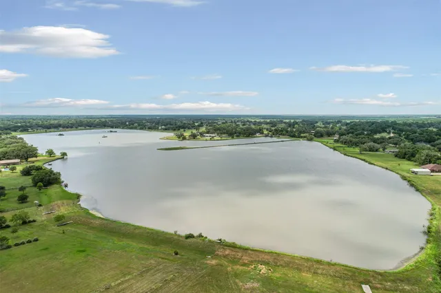 a view of a lake with a big yard