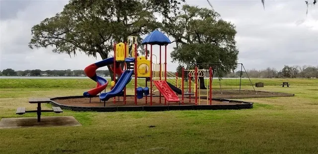 a view of a park with swings and slides
