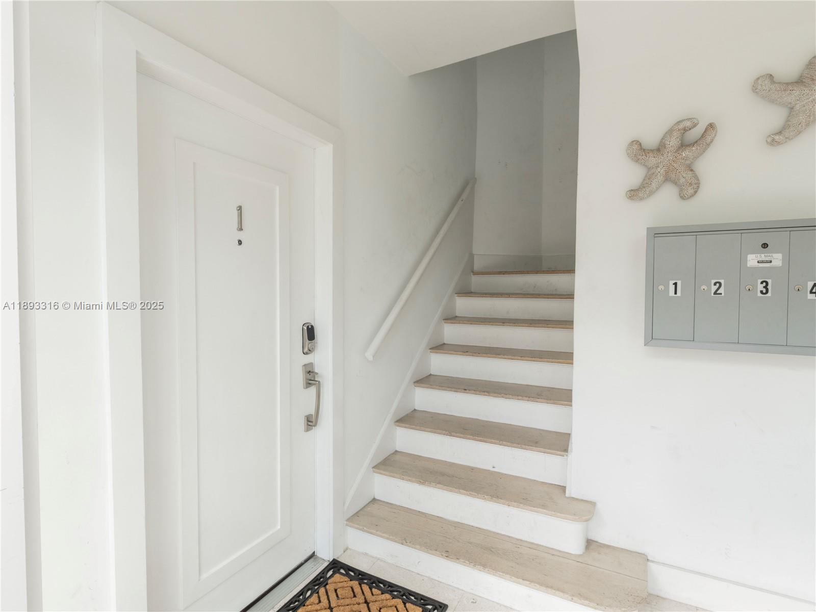 241 28th Street, Unit 1 Miami Beach, FL 33140 - Photo 16 of 16 a view of staircase with white walls