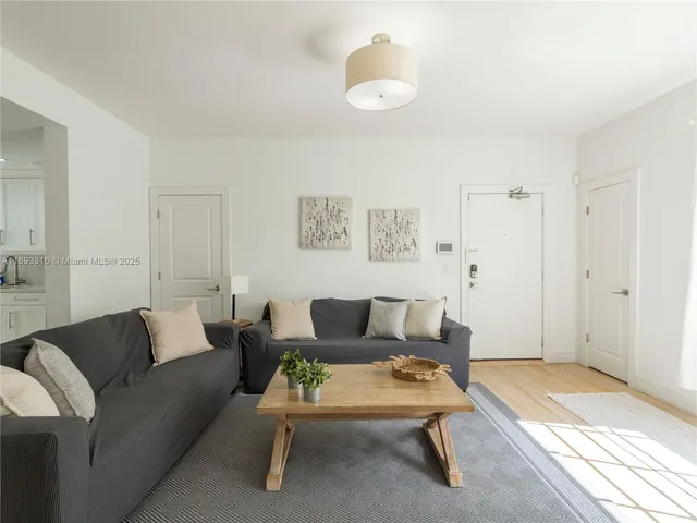 a living room with furniture and a rug