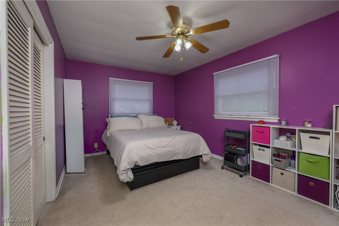 2856 Shellhart Road Barberton, OH 44203 - Photo 26 of 27 Bedroom featuring carpet floors, a closet, and ceiling fan