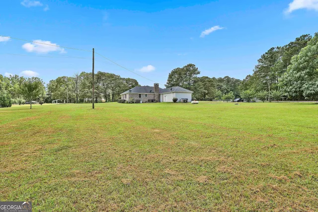 a view of a large body of water with a building in the background