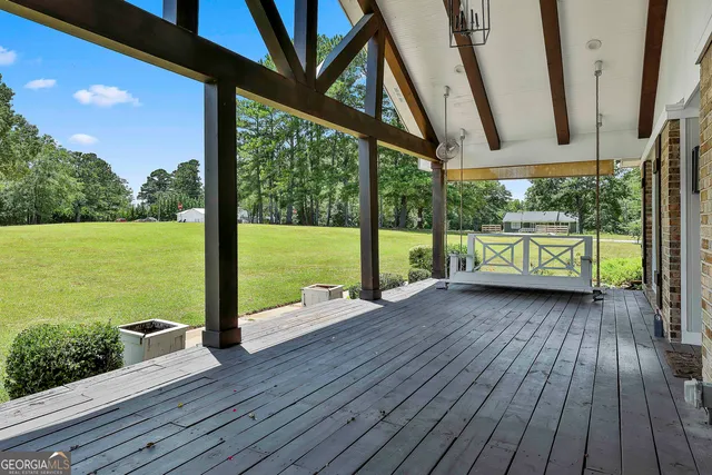 a view of a deck with wooden floor
