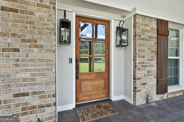 a view of walk in closet and window