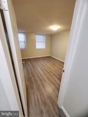 a bathroom with a granite countertop shower and a sink