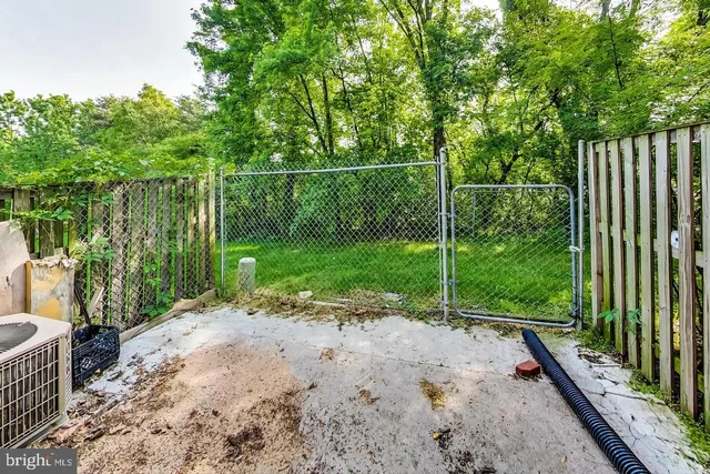 a kitchen with granite countertop a stove and a refrigerator
