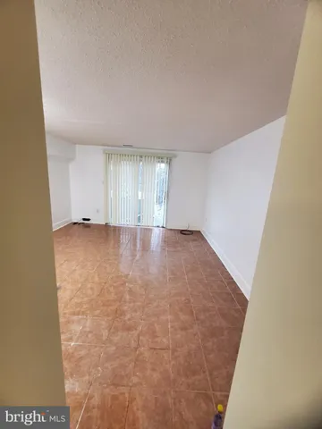 a view of room with wooden floor