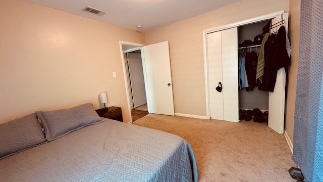 4614 Raintree Boulevard Austin, TX 78745 - Photo 7 of 14 a bedroom with a bed and a closet