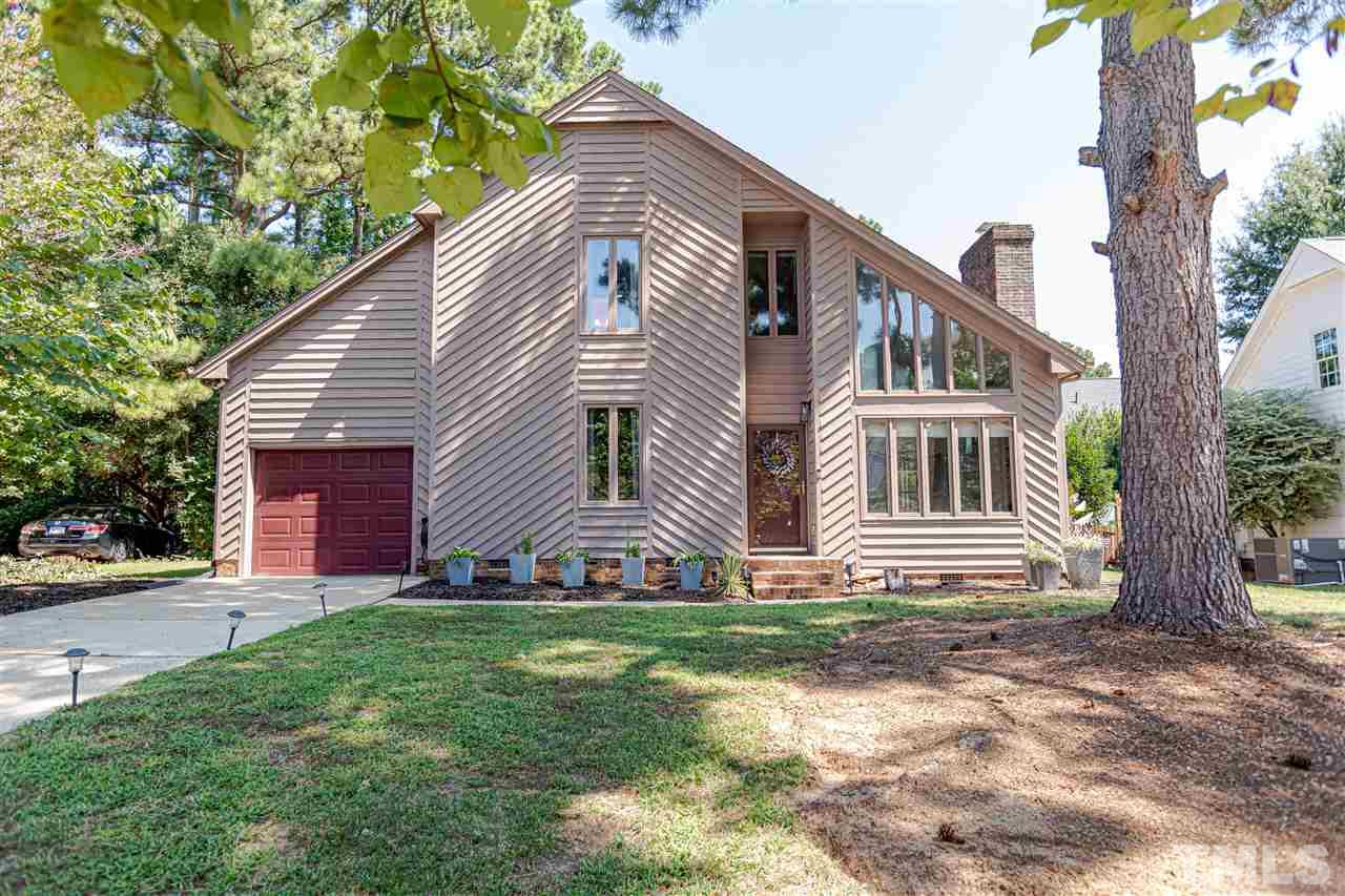 2521 Scouting Trail Raleigh, NC 27615 - Photo 2 of 29 a front view of a house with a yard and garage