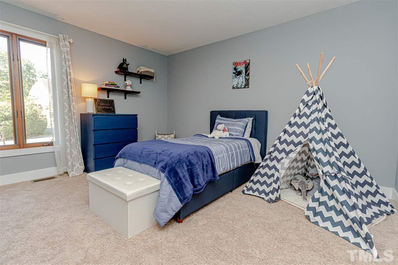 2521 Scouting Trail Raleigh, NC 27615 - Photo 15 of 29 a bedroom with bed and window
