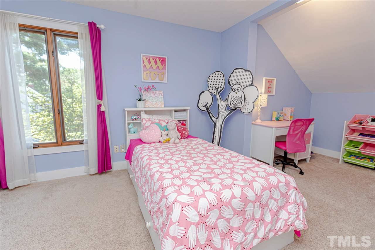 2521 Scouting Trail Raleigh, NC 27615 - Photo 17 of 29 a bedroom with a bed and a window