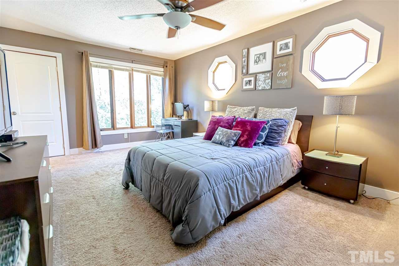 2521 Scouting Trail Raleigh, NC 27615 - Photo 23 of 29 a spacious bedroom with a bed and window