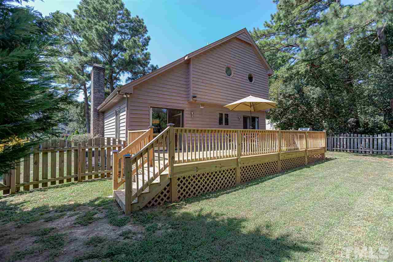 2521 Scouting Trail Raleigh, NC 27615 - Photo 28 of 29 a view of a house with a yard and a fence