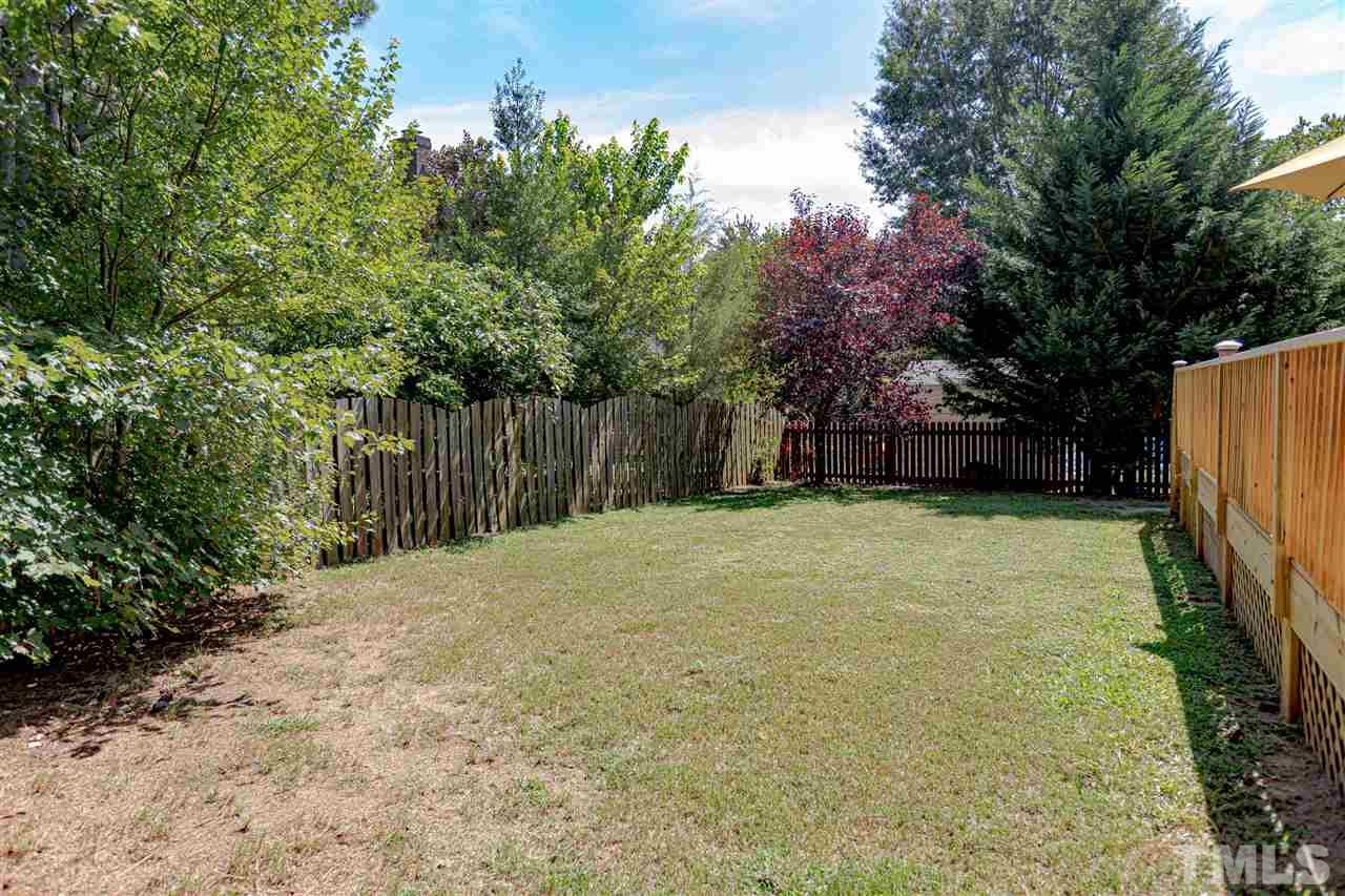 2521 Scouting Trail Raleigh, NC 27615 - Photo 29 of 29 a backyard of a house with lots of green space