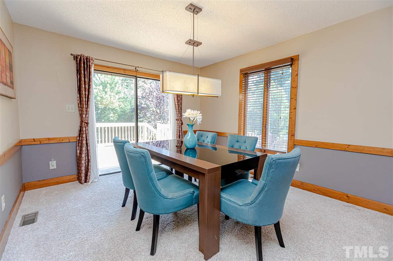 2521 Scouting Trail Raleigh, NC 27615 - Photo 8 of 29 a view of a dining room with furniture window and outside view
