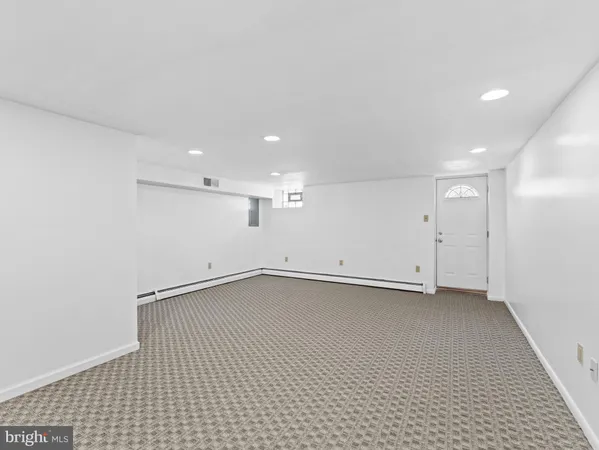 an empty room with a empty space and window