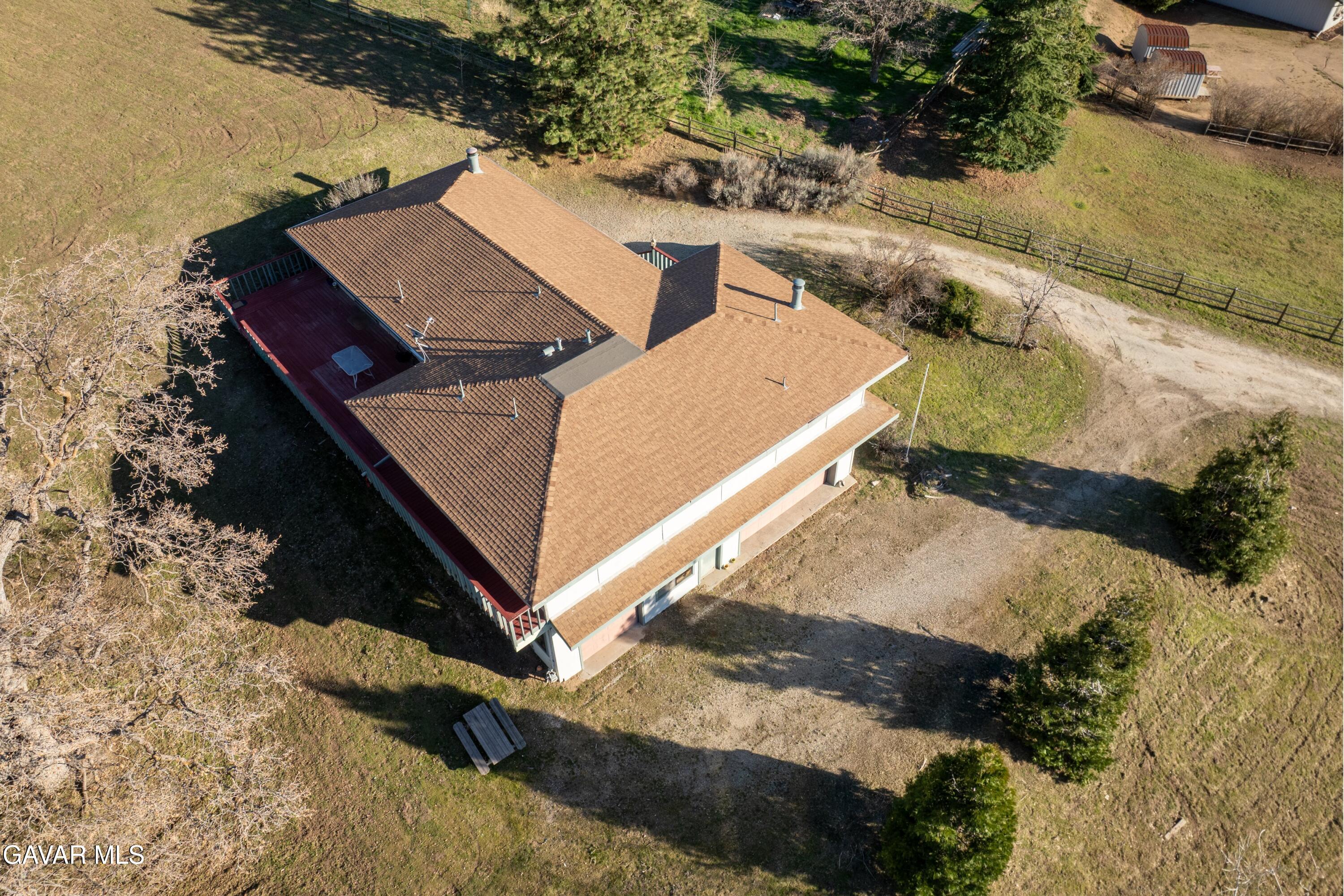 26181 Bear Valley Road Tehachapi, CA 93561 - Photo 11 of 38 an aerial view of a house with a yard