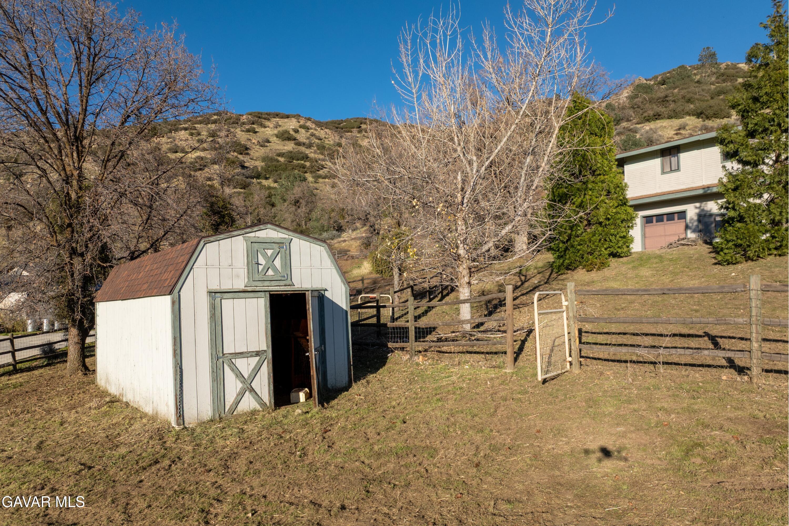 26181 Bear Valley Road Tehachapi, CA 93561 - Photo 20 of 38 a view of a house with a snow in the yard
