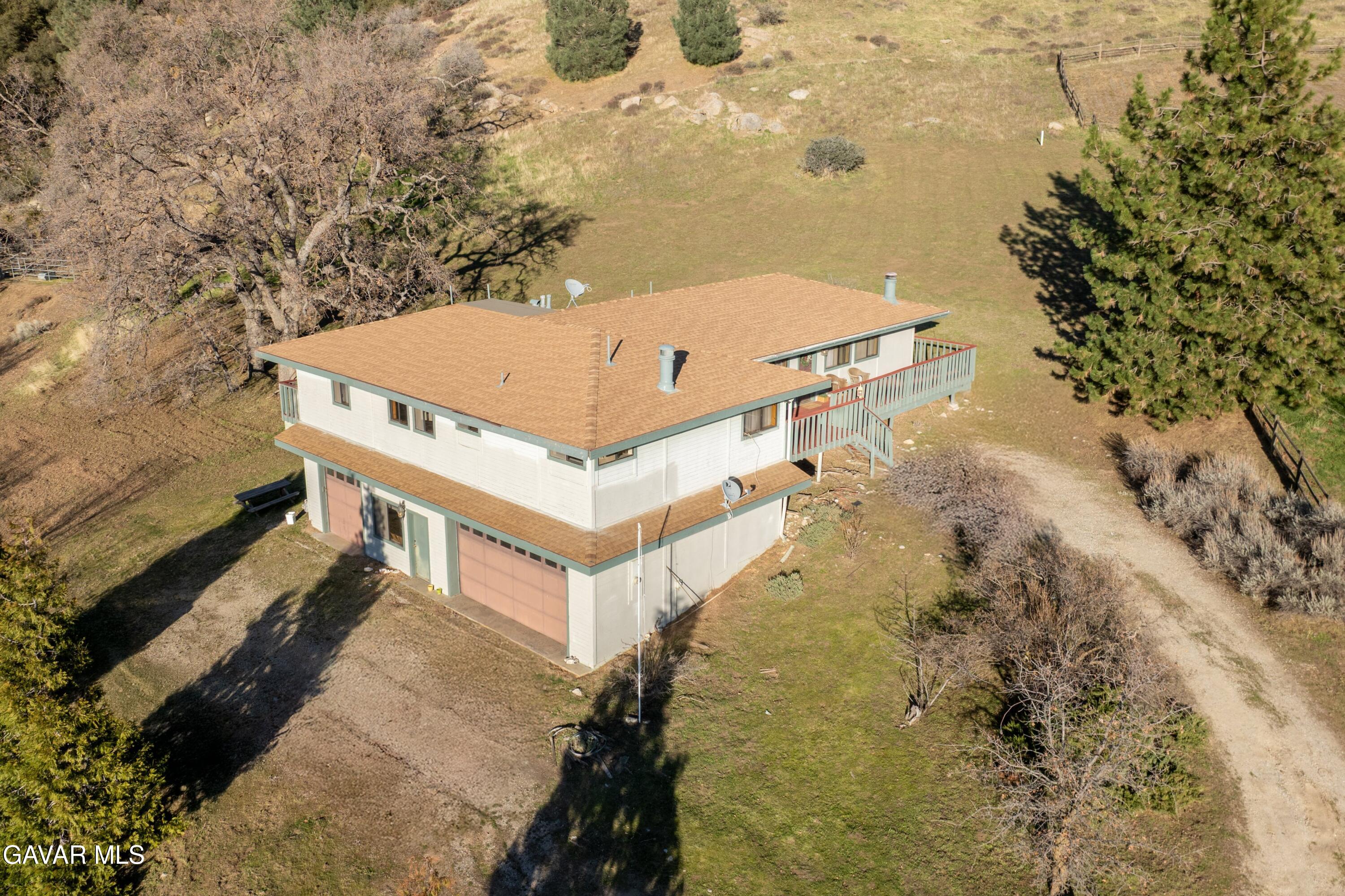 26181 Bear Valley Road Tehachapi, CA 93561 - Photo 2 of 38 a view of a house with a yard