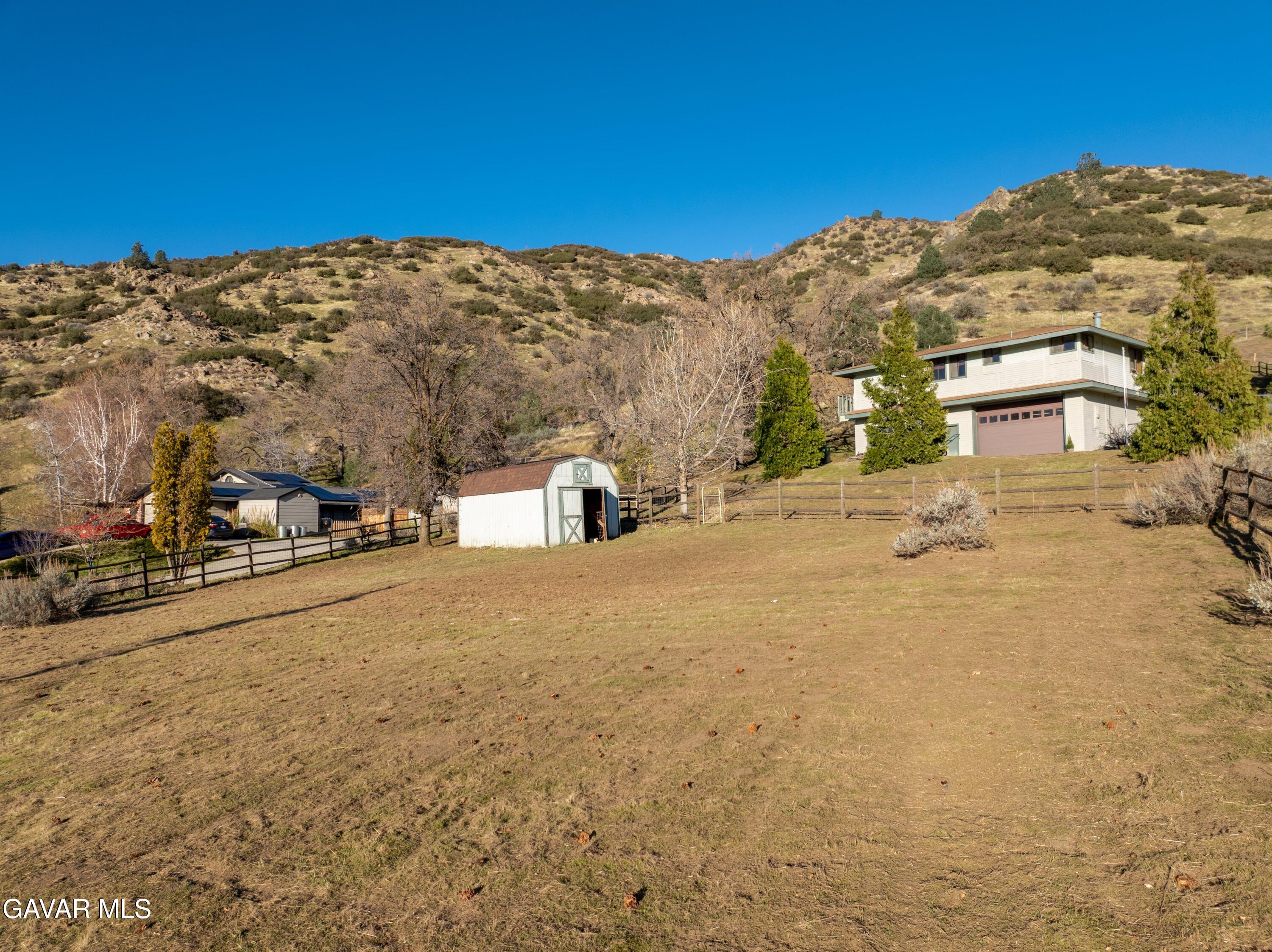26181 Bear Valley Road Tehachapi, CA 93561 - Photo 36 of 38 a view of a road with a building in the background