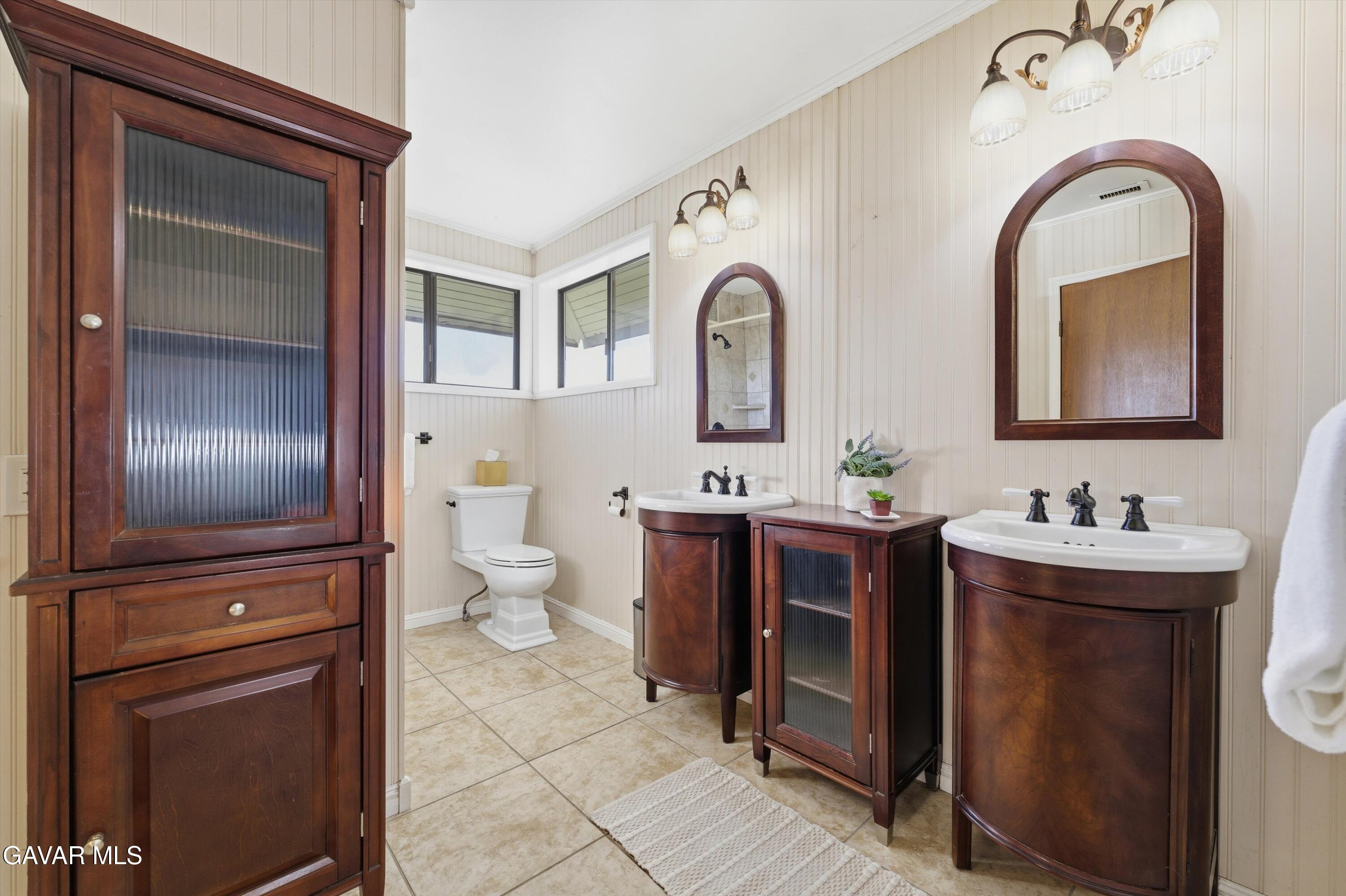26181 Bear Valley Road Tehachapi, CA 93561 - Photo 8 of 38 a bathroom with a toilet sink and mirror