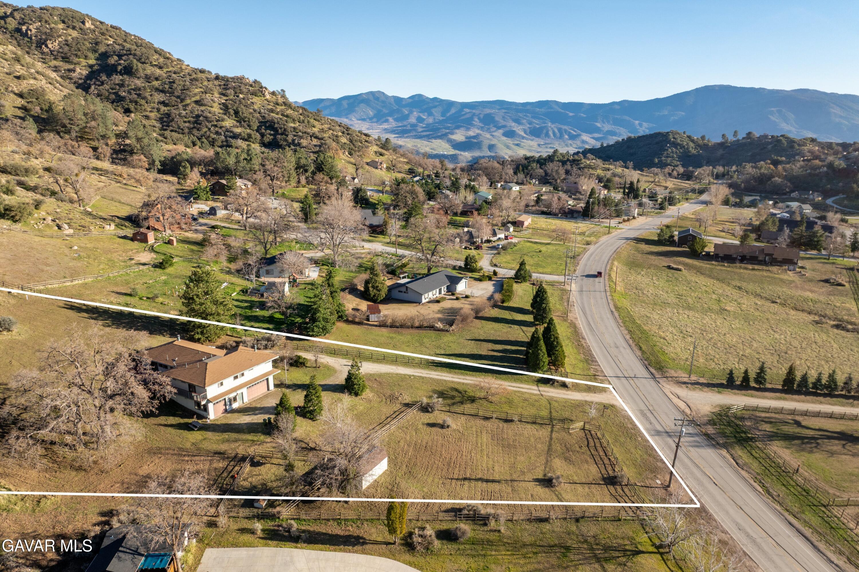26181 Bear Valley Road Tehachapi, CA 93561 - Photo 10 of 38 a view of a swimming pool with a mountain