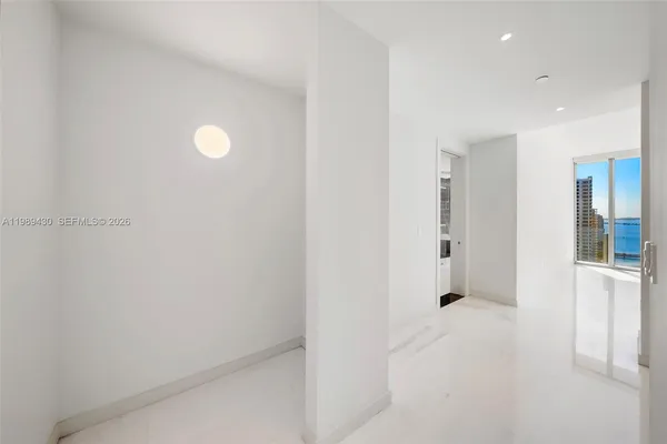 a view of an empty room and window