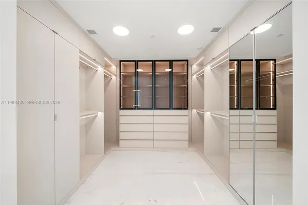 a spacious bathroom with a double vanity sink mirror and double