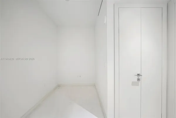a bathroom with a shower a toilet and sink