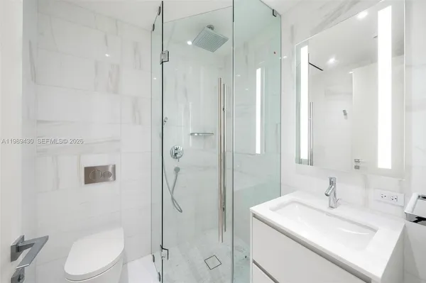 a view of an empty room with glass door