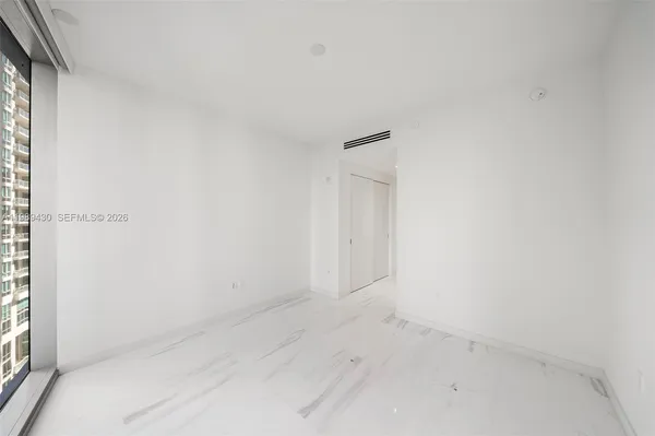 a bathroom with a sink a vanity and a shower