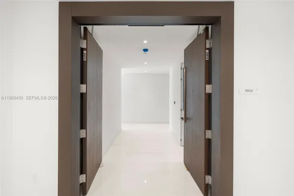 a bathroom with a shower and a sink