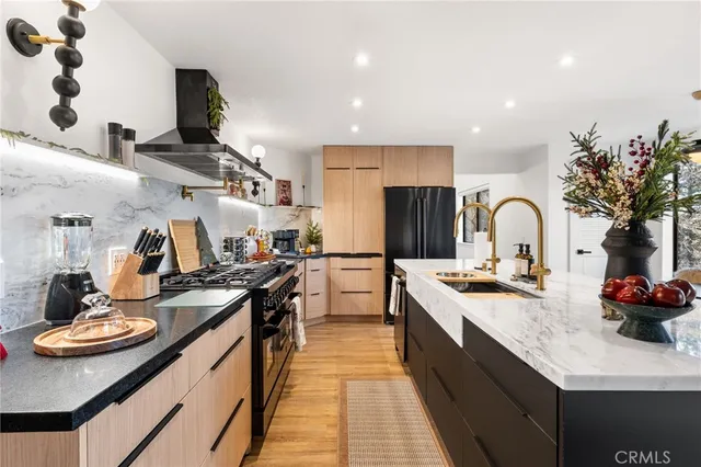 a kitchen with a sink and stove
