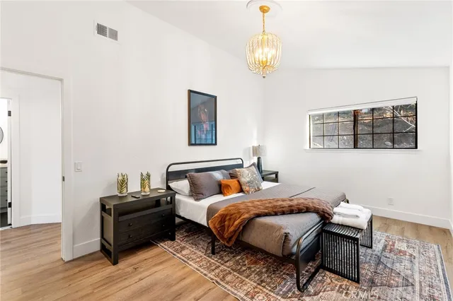 a bedroom with bed and window