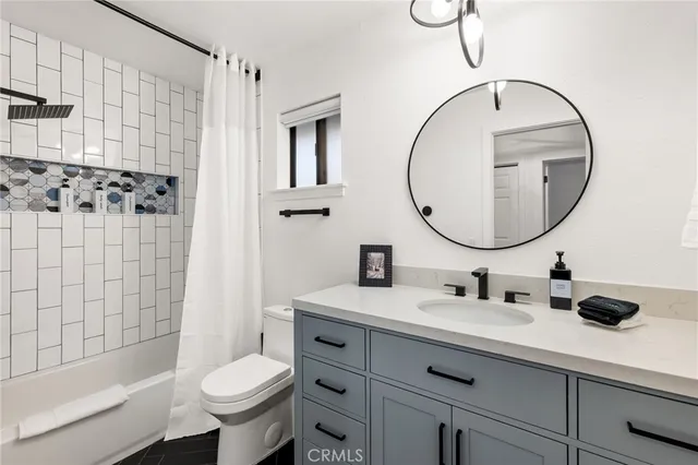 a bedroom with a bed and a fireplace