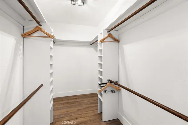 a bathroom with a tub a sink and mirror