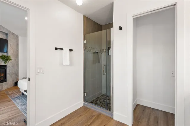 a hallway with sliding door and stairs