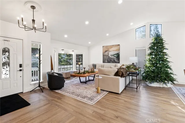 a living room with furniture or window and a wooden floor