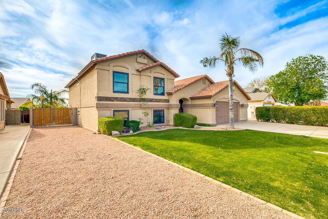 708 South Riata Street Gilbert, AZ 85296 - Photo 2 of 52 a front view of a house with garden