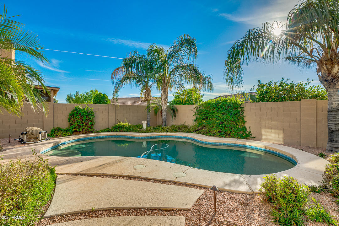 708 South Riata Street Gilbert, AZ 85296 - Photo 40 of 52 a view of a swimming pool with a patio