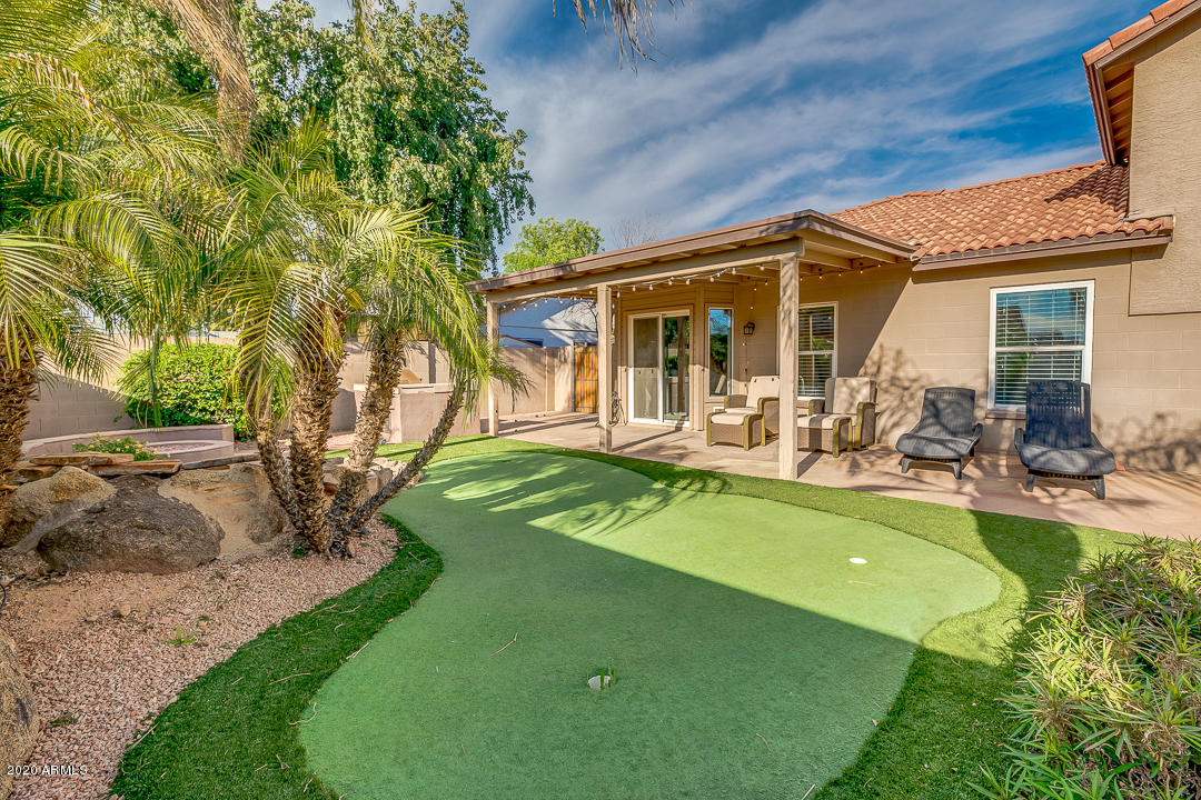 708 South Riata Street Gilbert, AZ 85296 - Photo 42 of 52 a view of a house with swimming pool and sitting area